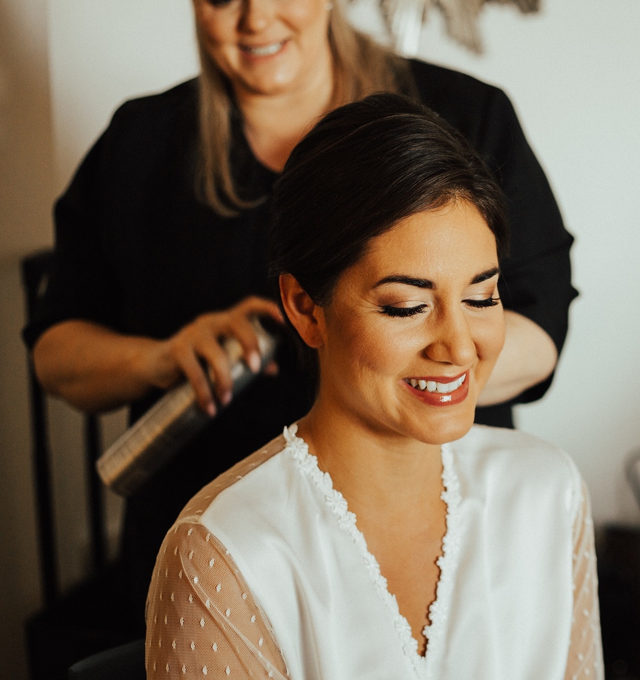 Smiling Bride Getting Wedding Hair and Makeup Done by Kristy's Artist in Orlando