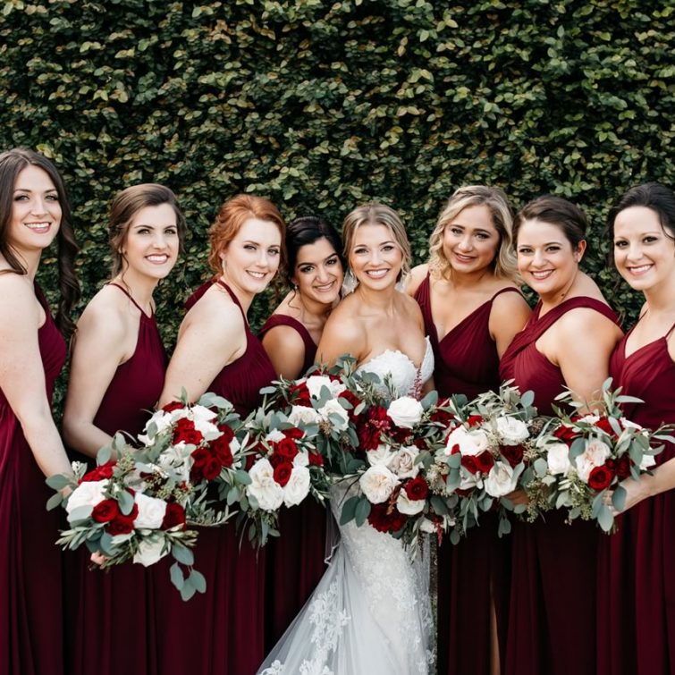 Bridal Party: Bride and 7 Bridesmaids Showing Off Hair and Makeup by Kristy's Artistry Design Team