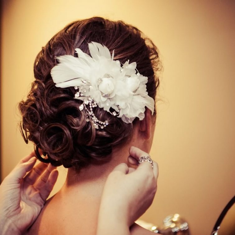 Close-up of an elegant updo hairstyle by Kristy's Artistry Design Team
