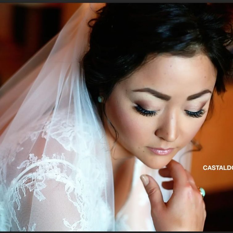 Bride's Perfect Pose: Hair and Makeup by Kristy's Artistry Design Team