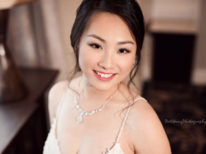 Asian Bride with Beautiful Hair and Flawless Makeup by Kristy's Artistry Design Team in Orlando