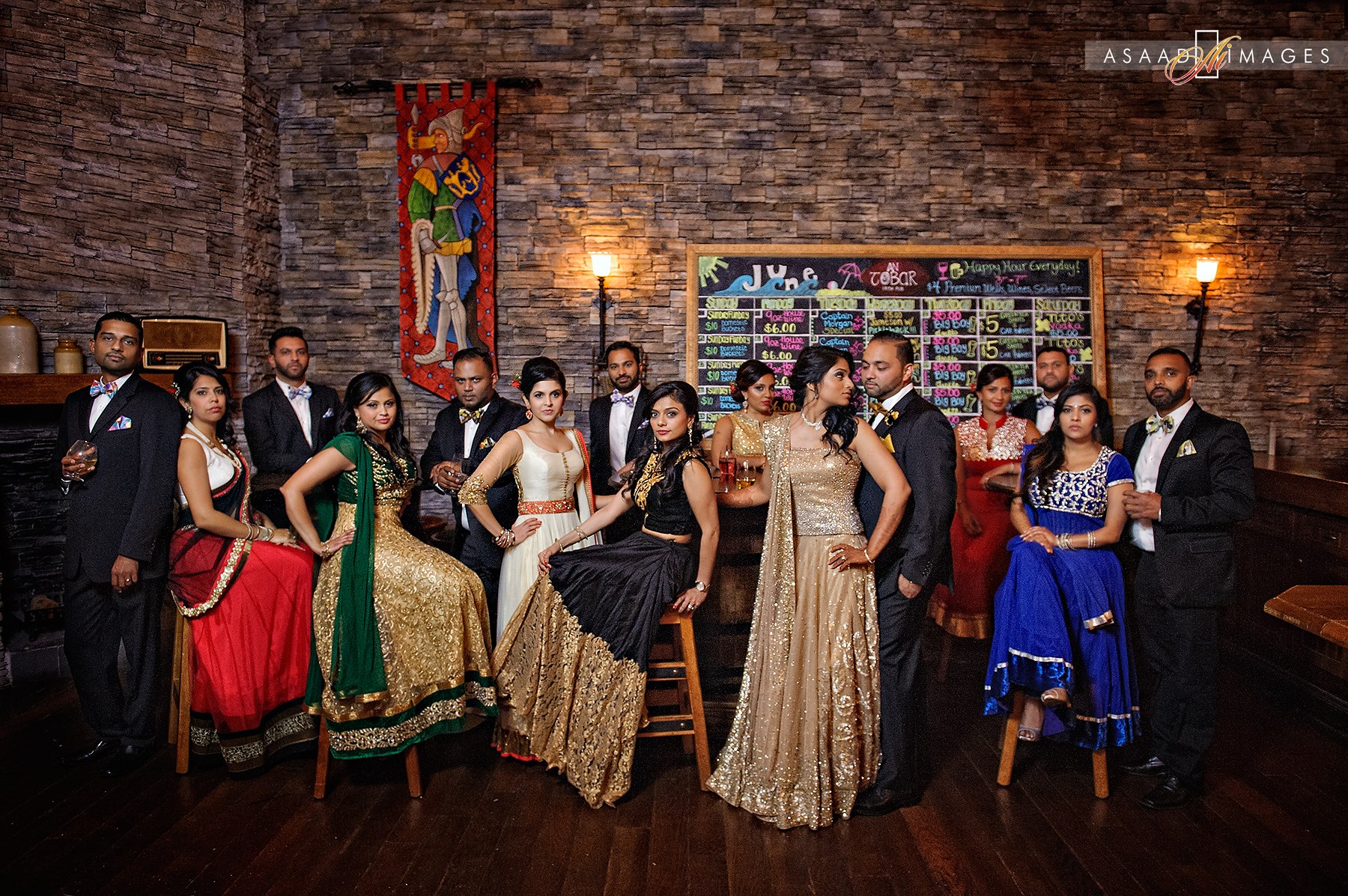 Epic photo of the bride and her bridesmaids in a modern traditional Indian wedding party, all with hair and makeup done by Kristy's Artistry Design Team.