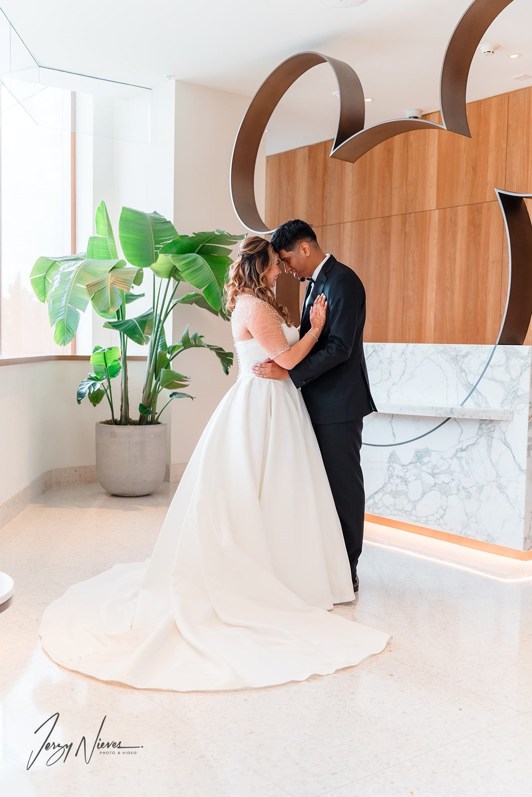 Bride showcasing her beautiful wedding hair and makeup at her Disney wedding, expertly done by Kristy's Artistry Design Team.