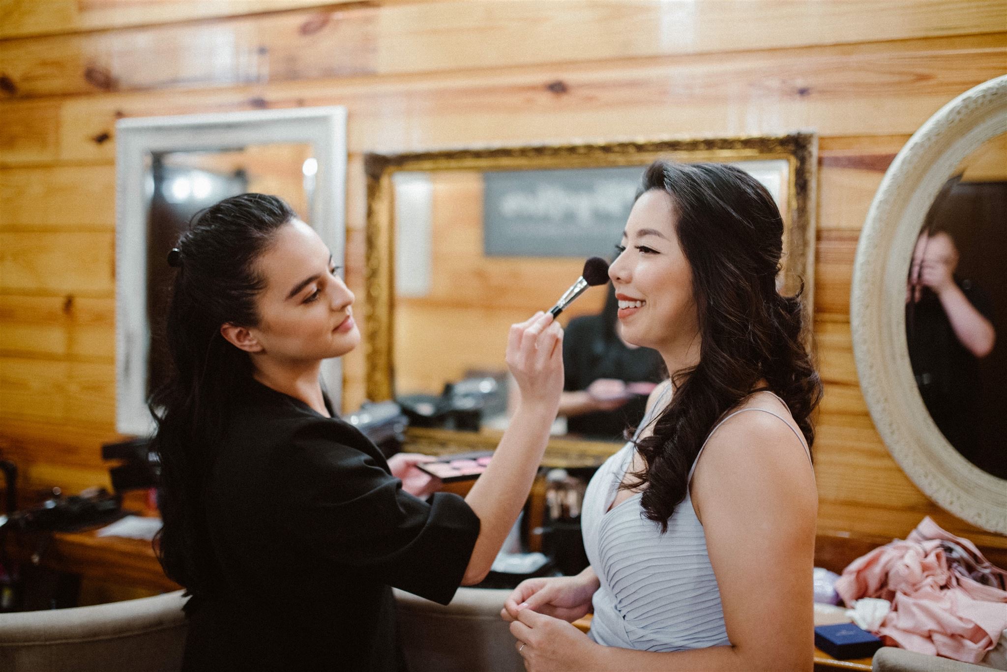 Artist from Kristy's Artistry Design Team adding finishing touches to bridal makeup in Orlando, FL.