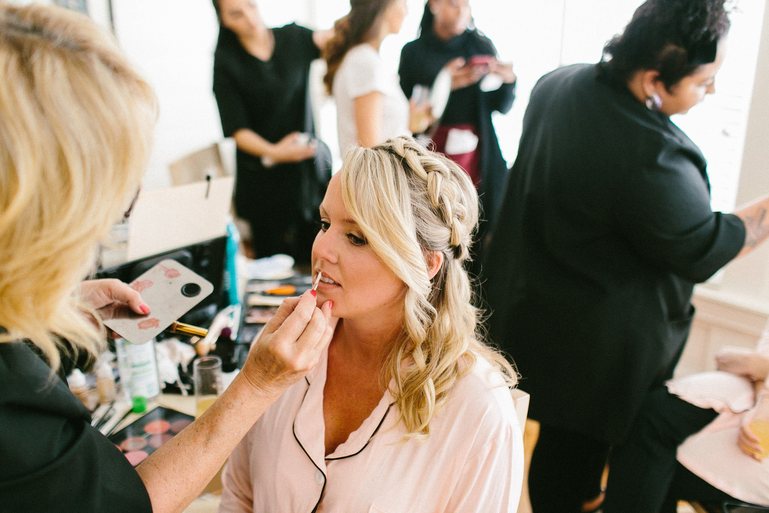 Kristy's Artistry Design Team working on the bridal party simultaneously, showcasing their efficiency and professionalism in mobile wedding hair and makeup.