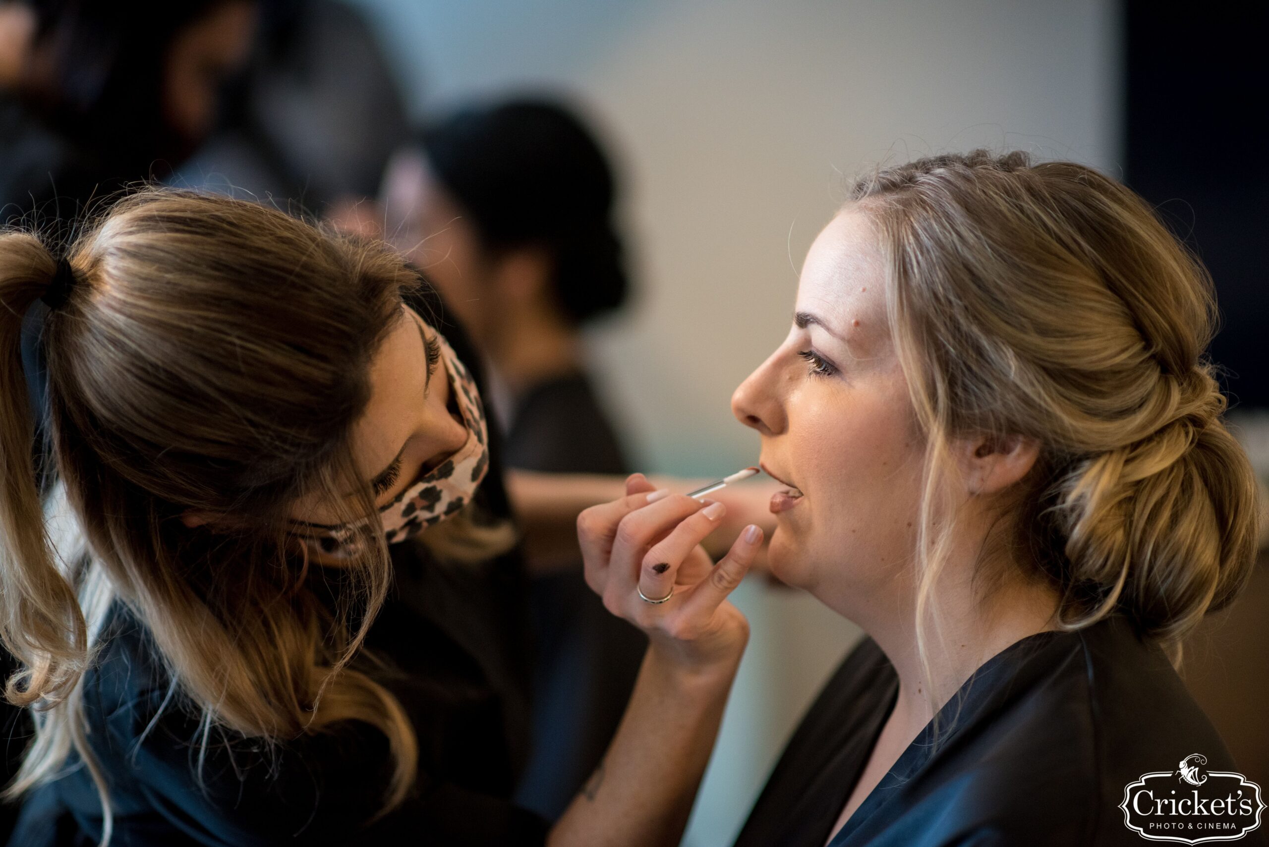 Artists applying makeup to the bridal party for an Orlando wedding.