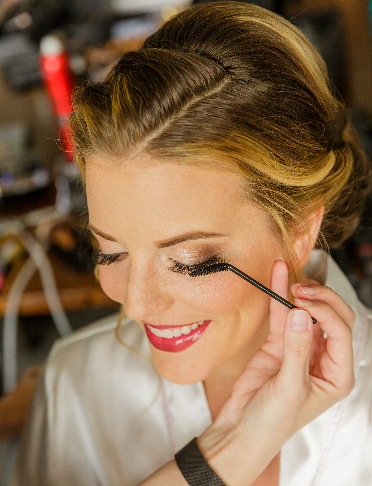 The best makeup artist near me, Kristy's Artistry, shown applying eyelash filler.