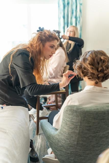 Kristy's Artistry Design Team doing bridal hair and makeup