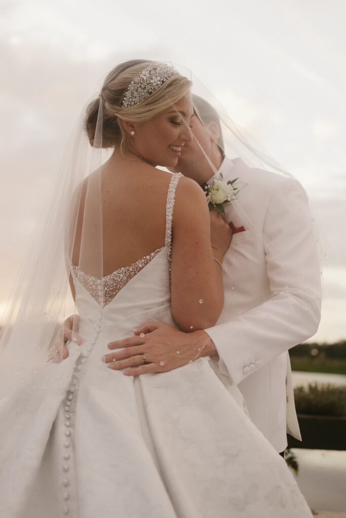 bride and groom under her veil