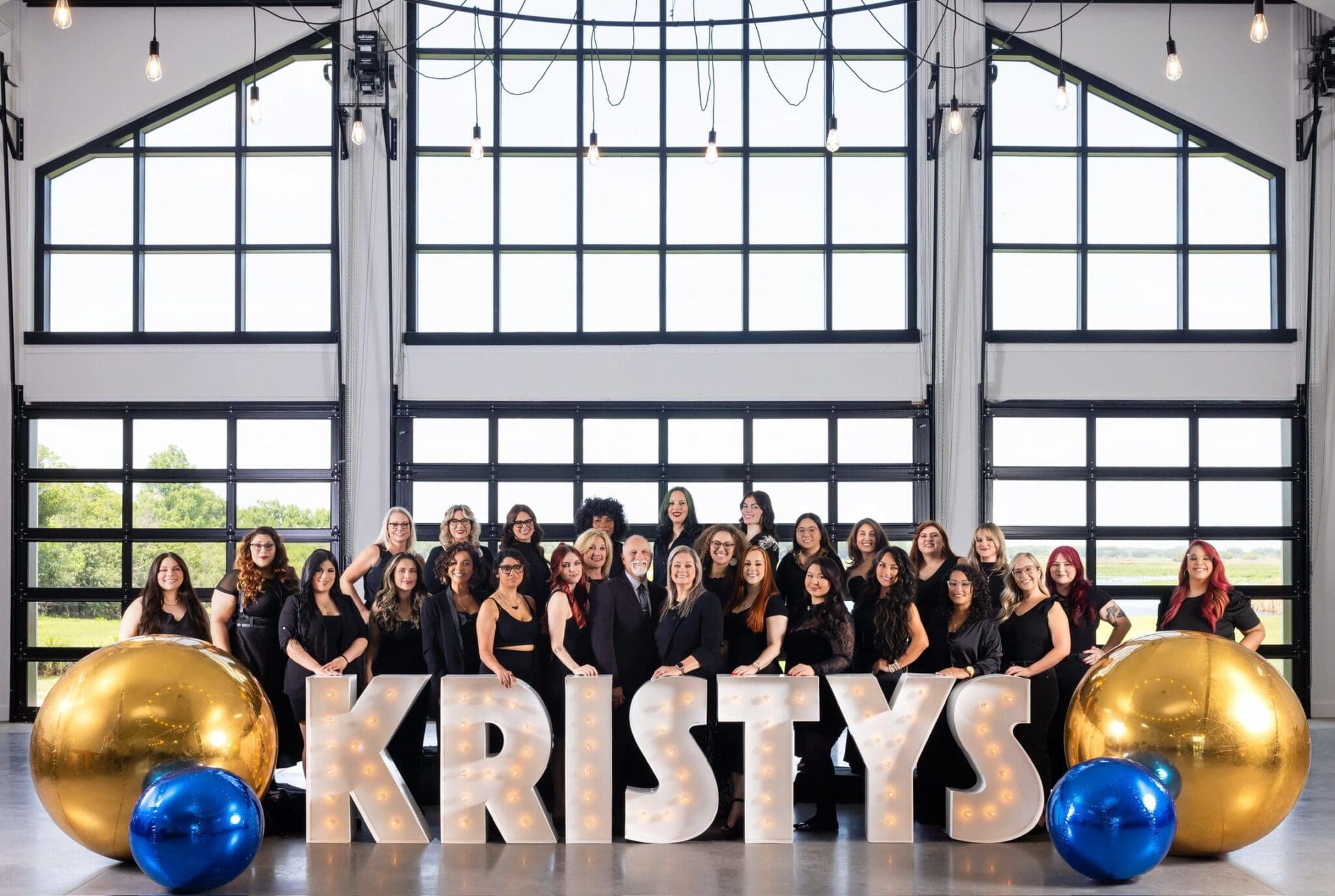 Kristy's Artistry Design Team hairstylists and makeup artists' team.