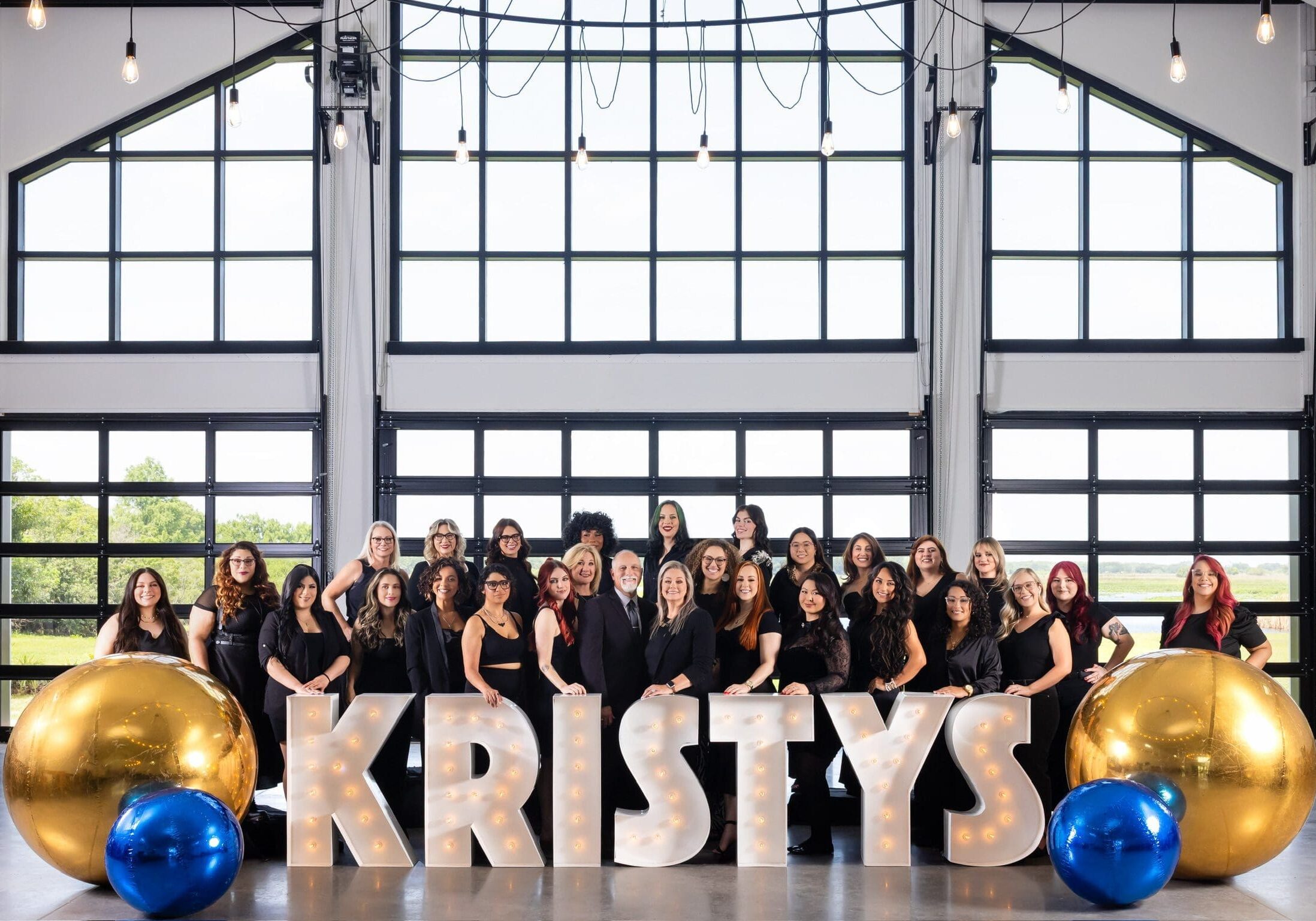 Kristy's Artistry Design Team hairstylists and makeup artists' team.